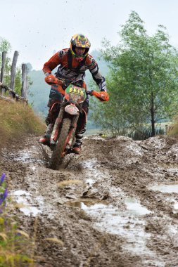 SIBIU, ROMANIA - JULY 16: A competitor in Red Bull ROMANIACS Hard Enduro Rally with a KTM motorcycle. The hardest enduro rally in the world. July 12-16, 2016 in Sibiu, Romania.