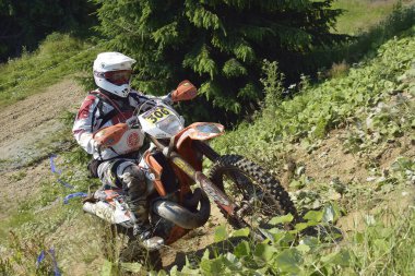 SIBIU, ROMANIA - JULY 16: A competitor in Red Bull ROMANIACS Hard Enduro Rally with a KTM motorcycle. The hardest enduro rally in the world. July 12-16, 2016 in Sibiu, Romania.