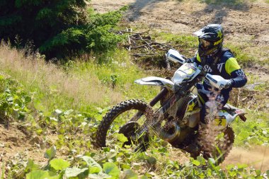 SIBIU, ROMANIA - JULY 16: A competitor in Red Bull ROMANIACS Hard Enduro Rally with a KTM motorcycle. The hardest enduro rally in the world. July 12-16, 2016 in Sibiu, Romania.
