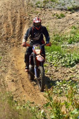 SIBIU, ROMANIA - JULY 16: A competitor in Red Bull ROMANIACS Hard Enduro Rally with a KTM motorcycle. The hardest enduro rally in the world. July 12-16, 2016 in Sibiu, Romania.