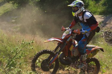 SIBIU, ROMANIA - JULY 16: A competitor in Red Bull ROMANIACS Hard Enduro Rally with a KTM motorcycle. The hardest enduro rally in the world. July 12-16, 2016 in Sibiu, Romania.
