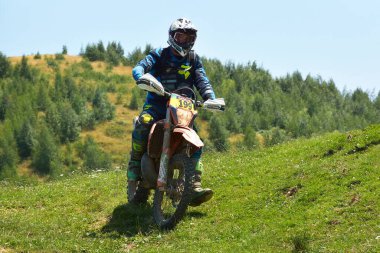 SIBIU, ROMANIA - JULY 16: A competitor in Red Bull ROMANIACS Hard Enduro Rally with a KTM motorcycle. The hardest enduro rally in the world. July 12-16, 2016 in Sibiu, Romania.