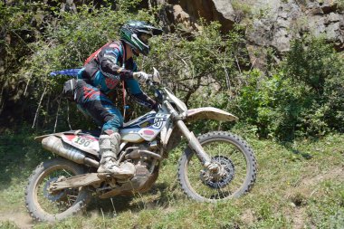 SIBIU, ROMANIA - JULY 16: A competitor in Red Bull ROMANIACS Hard Enduro Rally with a KTM motorcycle. The hardest enduro rally in the world. July 12-16, 2016 in Sibiu, Romania.
