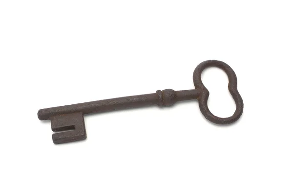 Alter Schlüssel auf weißem Hintergrund — Stockfoto