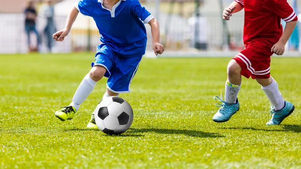 Young football players playing football soccer game. Running pla — Stock Photo, Image