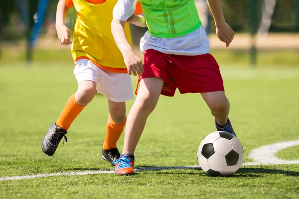 Boys playing football soccer game match — Stock Photo, Image