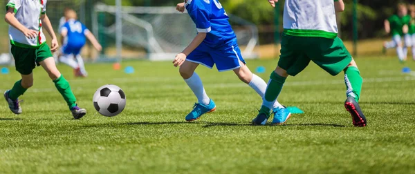 Soccer players running with ball — Stock Photo, Image