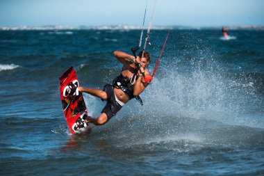 kite surfer rides waves clipart