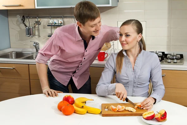 Lovely couple on kitchen — Stock Photo, Image