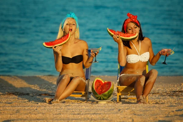 Ladies with watermelon on seaside — Stock Photo, Image