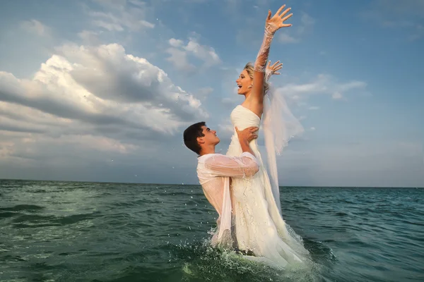 Couple having fun in sea Stock Photo