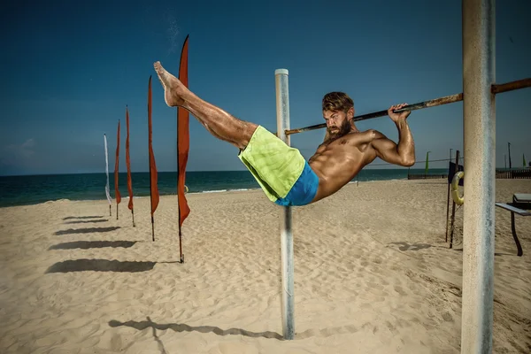 Athlete doing pull-up on horizontal bar — Stock Image Athlete doing pull-up on horizontal bar Stock Image