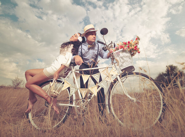 Groom and bride on a bicycle