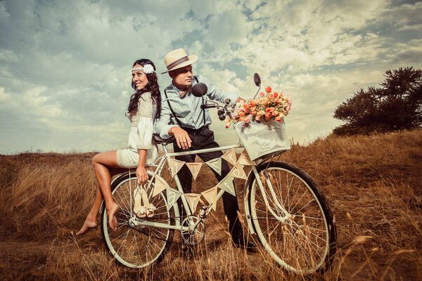 Groom and bride on a bicycle