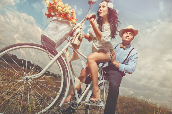 Groom and bride on a bicycle