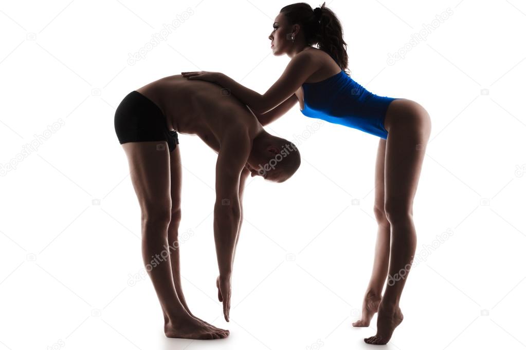 Female trainer helping guy
