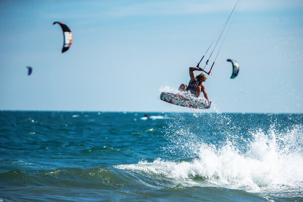 Handsome man Kitesurfing