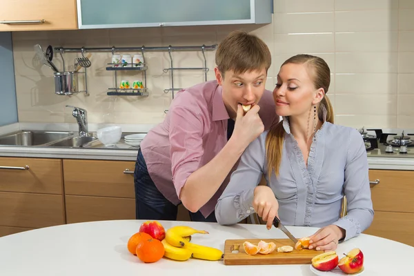 Lovely couple in kitchen — Stock Photo, Image