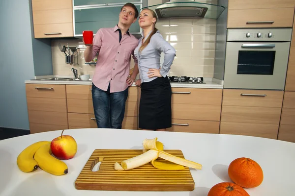 Lovely couple in kitchen — Stock Photo, Image