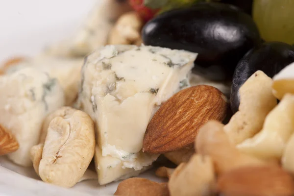 Cheese plate with grapes and nuts