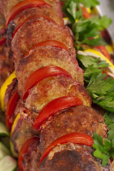 Baked fish with tomato and lemon slices — Stock Image Baked fish with tomato and lemon slices Stock Picture