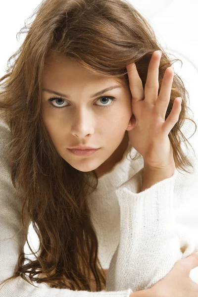 Girl in white wool sweater Stock Picture