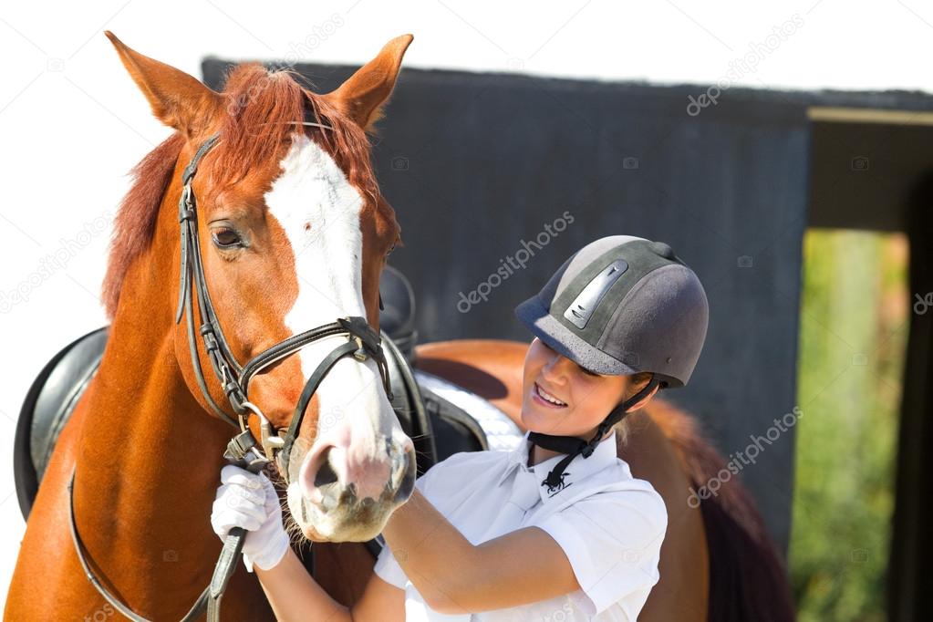 female jockey with purebred horse