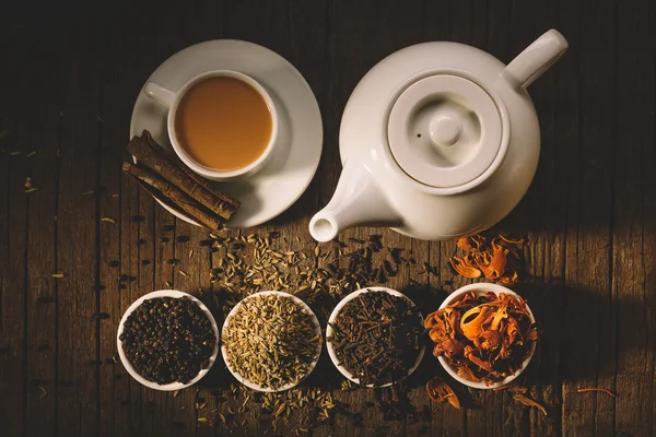 Teapot and cup of hot tea — Stock Photo, Image