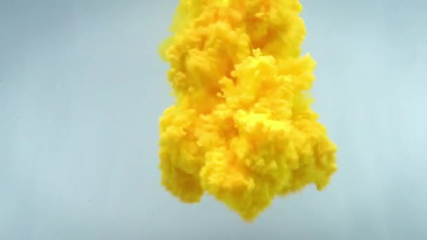 Slow motion yellow ink flow in water. 4K video footage. — Stock Video