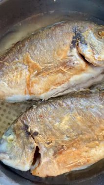 A close-up shot of fried fish. Cooking delicious food at home.