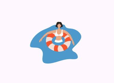 Denizde lastik bir halkada dinlenen bir kadın..