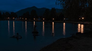 Long exposure night shot with reflections at the famous Tegernsee, Bad Wiessee, Bavaria, Germany
