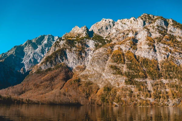 Beautiful autumn reflections at the famous Koenigssee-Bavaria-Germany