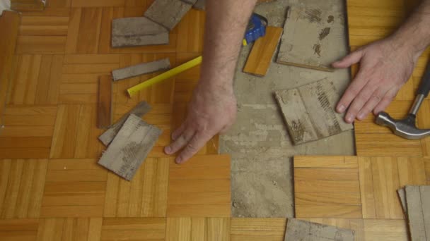 Handyman Removing Damaged Parquet — Stock Video