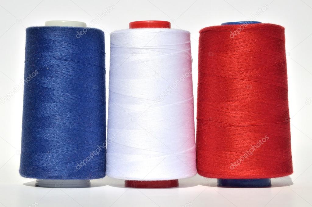 Blue, white and red thread