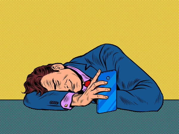 A man sleeps near a smartphone