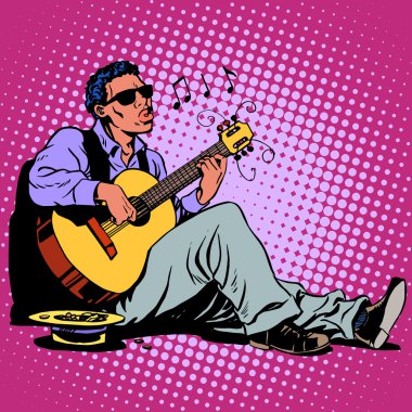 Afrika asıllı bir gitar ile sokak Blues müzisyeni