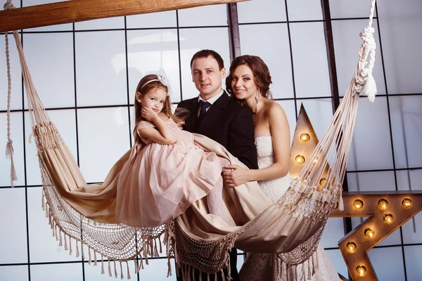 A happy family concept. Beautiful pregnant wife in wedding dress
