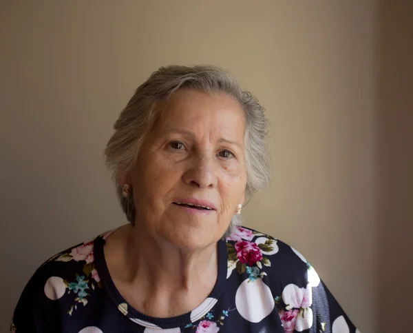 Portrait of smiling elderly woman — Stock Photo, Image