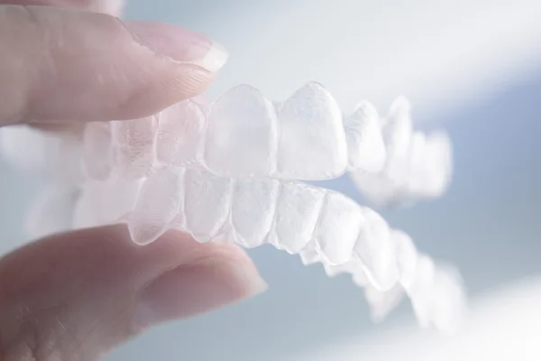 Invisible dental teeth brackets tooth aligners plastic braces re — Stock Photo, Image