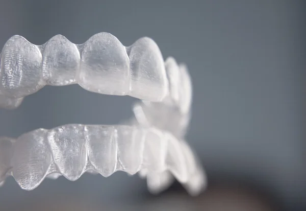 Invisible dental teeth brackets tooth aligners plastic braces re — Stock Photo, Image