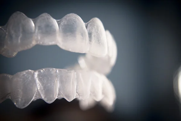 Invisible dental teeth brackets tooth aligners plastic braces re — Stock Photo, Image