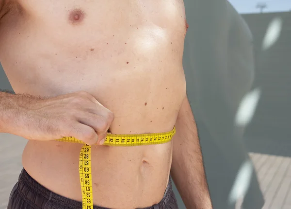 Man measuring body contouring — Stock Photo, Image