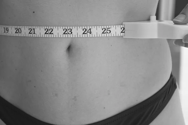 Woman measuring body contouring — Stock Photo, Image