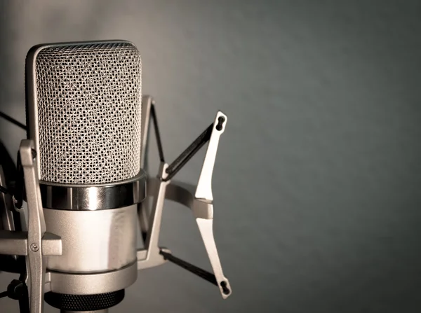 Silver microphone on blue gray background — Stock Photo, Image