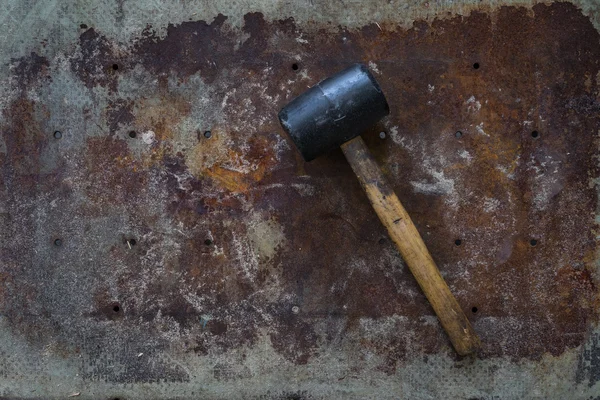 Rubber mallet on rustic surface