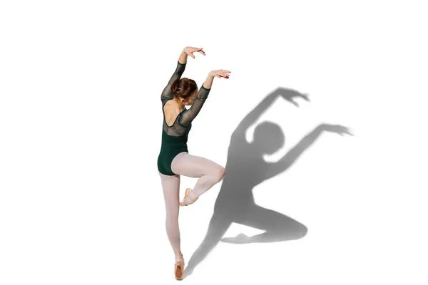 Young beautiful woman ballerina isolated over white background with shadow. — Stock Photo, Image