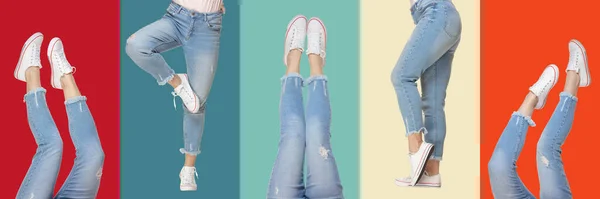 Ženské nohy v modrých džínách a sportovní obuv izolované na vícebarevném pozadí — Stock fotografie