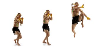 Beyaz arka planda profesyonel Tayland boksörü atlama hareketinde..