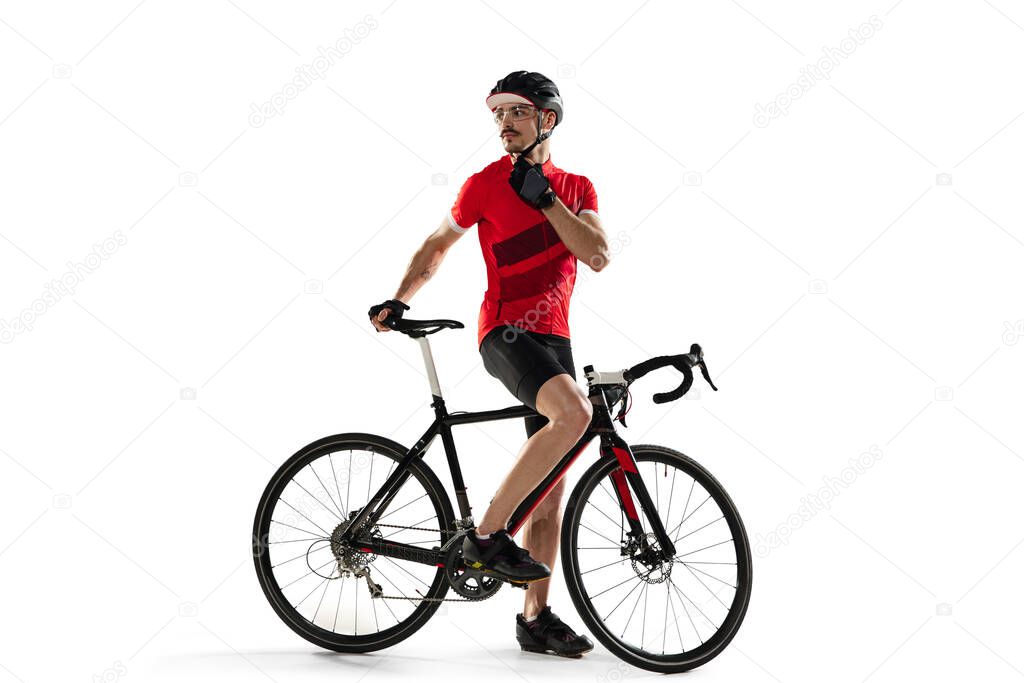 Professional male bike rider with road bike isolated over white background.